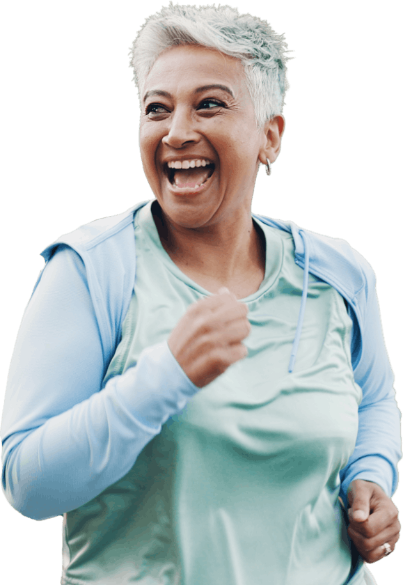 Smiling woman running with group of people - showing someone who is pain free